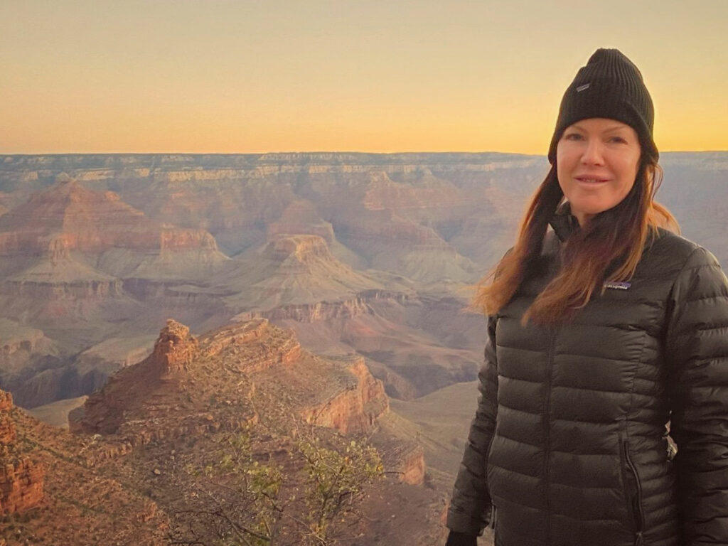 Kira Reed Lorsch looking over the rim of the Grand Canyon