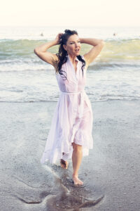 Kira in wet dress on the beach