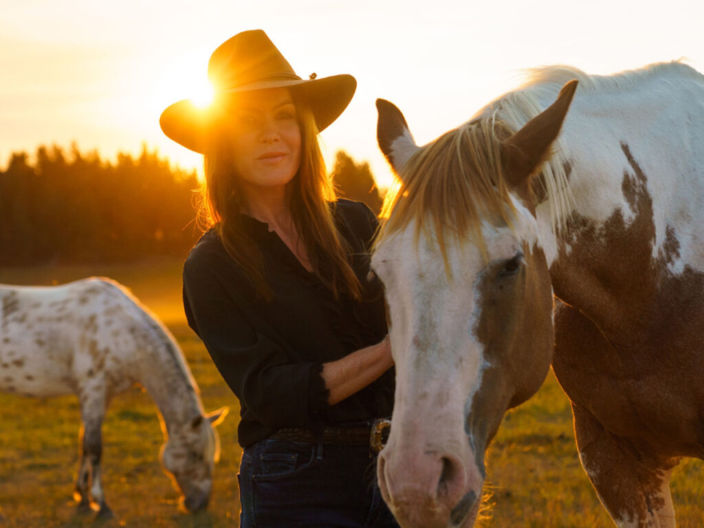 Kira with horses at sunset